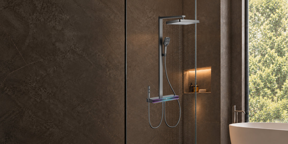 Rivo Viva Spa shower system in Ashen Grey, featuring an overhead rain shower, handheld shower and illuminated Shower Platform against dark stone bathroom walls.